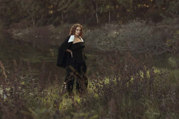 Black Pant Suit with a Detailed Corset and White Accent Trim on Blazer - Image 3