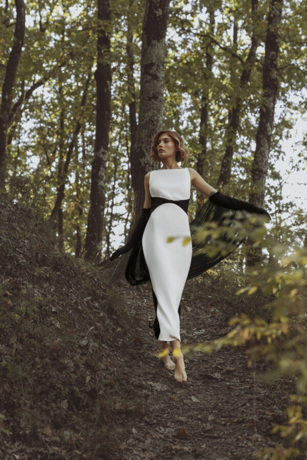 Long White Dress with Black Accents Around the Waist - Image 3