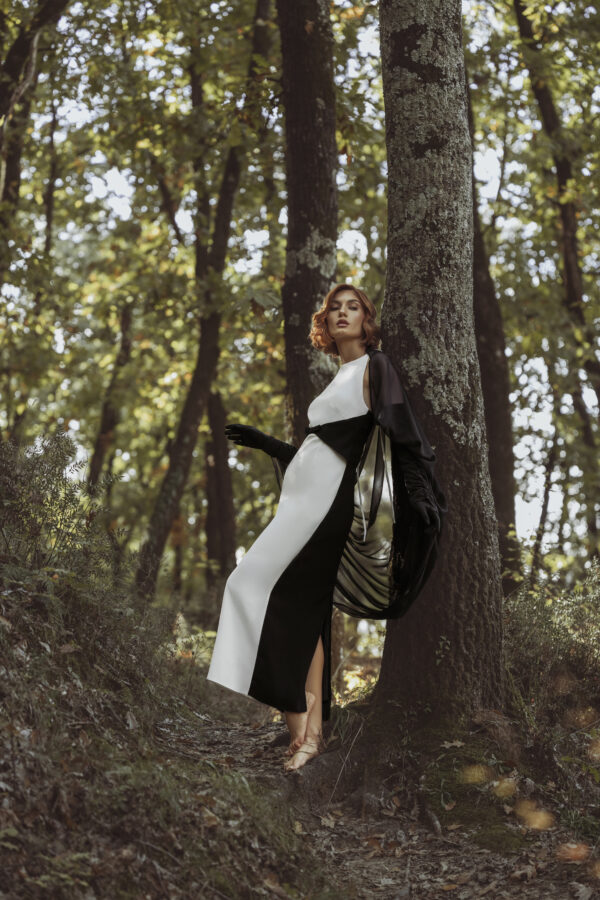 Long White Dress with Black Accents Around the Waist - Image 2